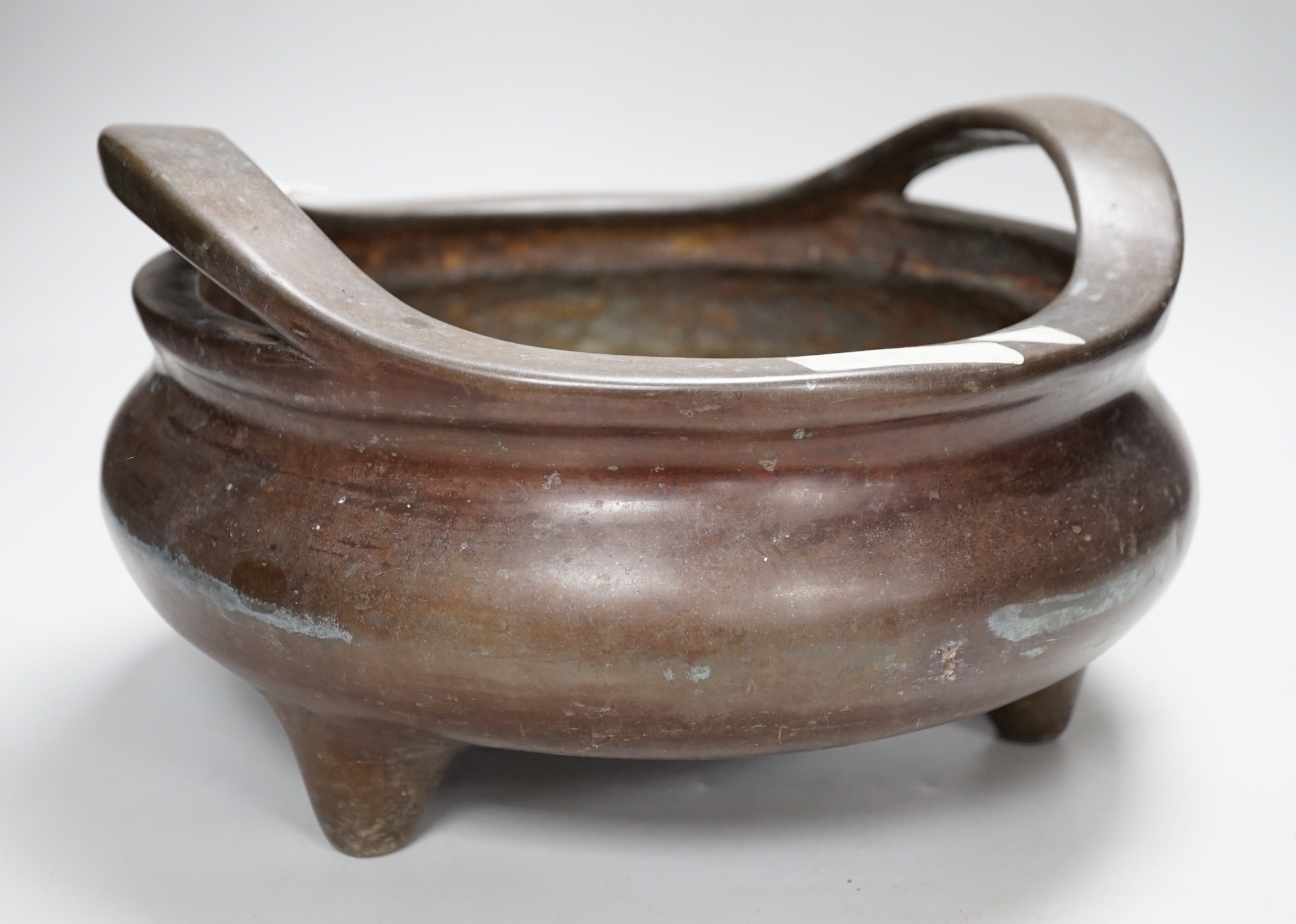 A large Chinese bronze censer, 30cm wide